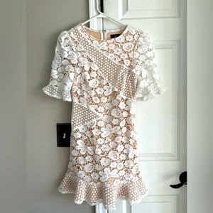White floral lace dress with tan lining.